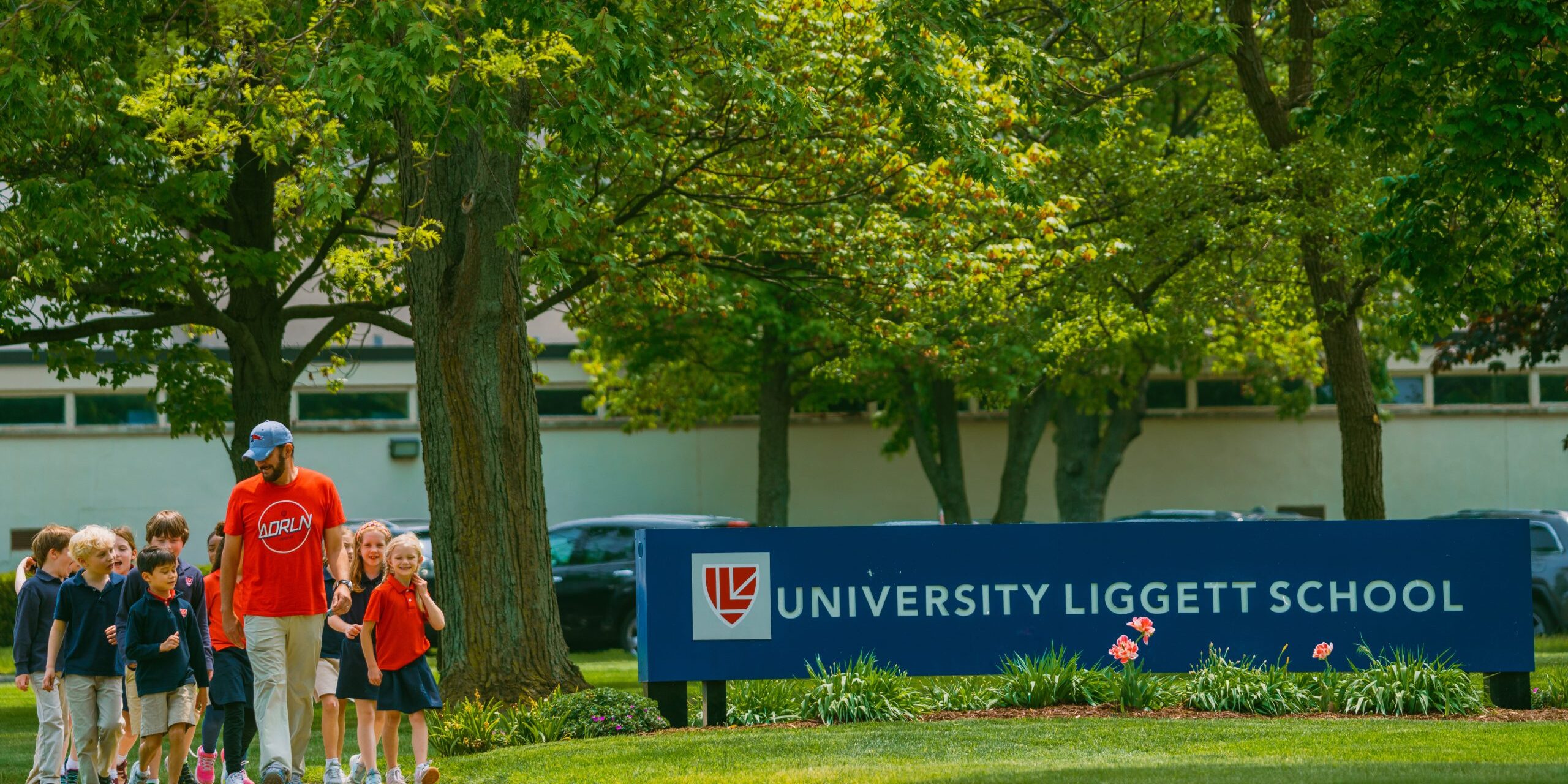 Students outside by sign | Excel at University Liggett School | Top Private School