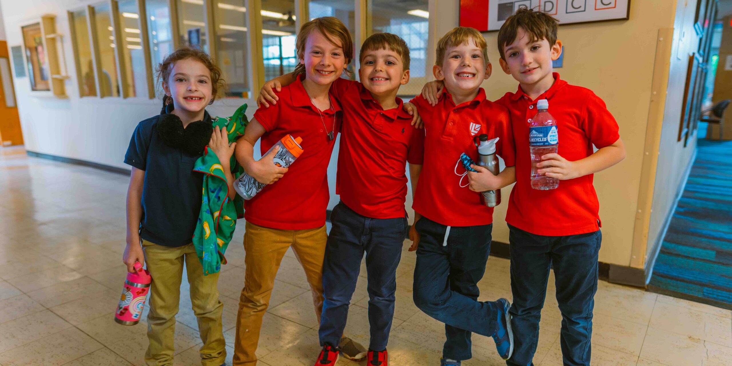 Lower School students smile in the hall