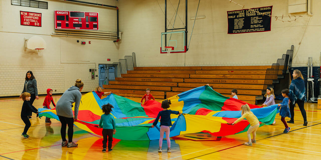 Prekindergarten fun with Parachute in gym class